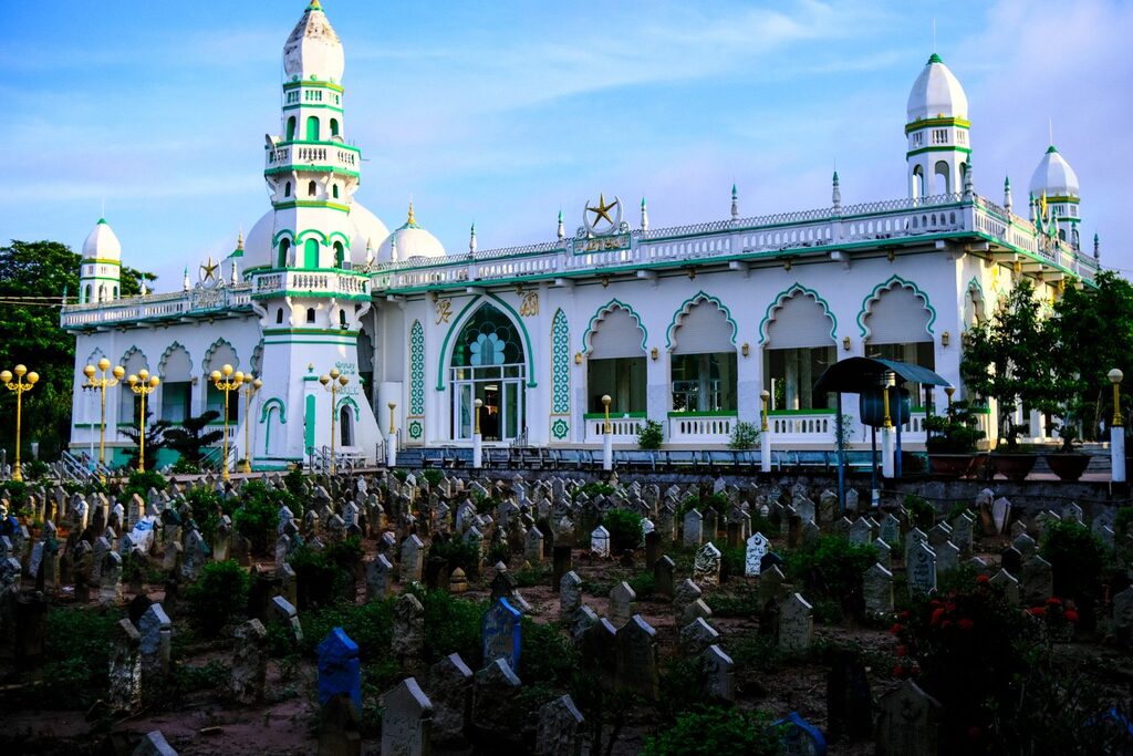A Cham mosque in An Giang province with a Muslim cemetery in front