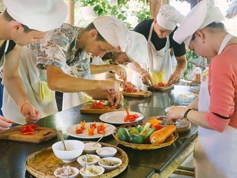 Day 2: Hoi An Market with the chef, basket boats at Cam Thanh and a seven-dish cooking class, then the Marble Mountains and Son Tra