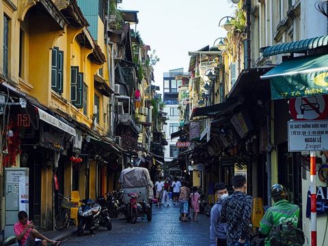 A narrow street of shops in the Hanoi Old Quarter