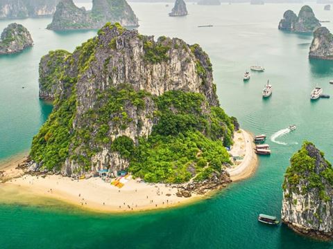 Day 3: Hanoi to Ha Long Bay: cruise among the islands, a cave and a kayak or swim