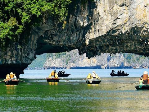 Day 3: Hanoi to Ha Long Bay: cruise among the islands, a cave and a kayak or swim