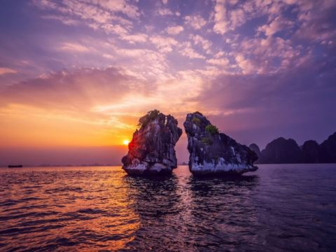 Day 8: Drive to Ha Long Bay and board the cruise: Surprise Cave, kayaks and a sunset on deck