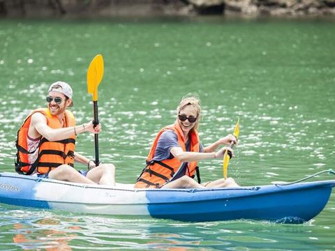 Two travellers kayaking on Ha Long Bay
